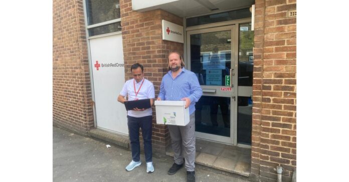 SocialBox.Biz IT innovator donates laptops to refugees