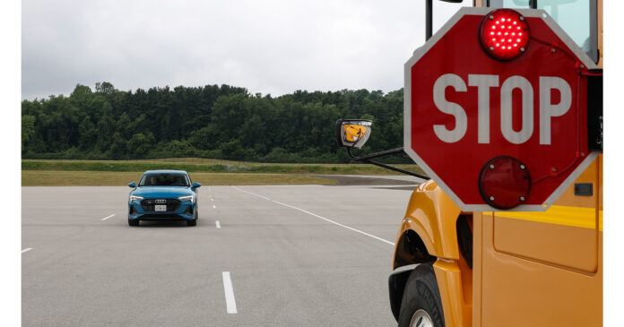 Audi and Navistar showcase technology designed to help make back to school safer at bus stops
