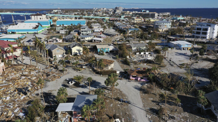 In this aerial view, the destruction left in the wake of Hurricane Ian is shown on October 02, 2022 in Fort Myers Beach, Florida. The state's home insurance market is reeling after disasters like this one. (Win McNamee/Getty Images)