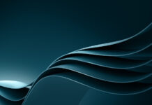 One year after its founding: Joint venture between Volkswagen Group and Rivian shows strong progress Abstract wave shape in dark blue tones.